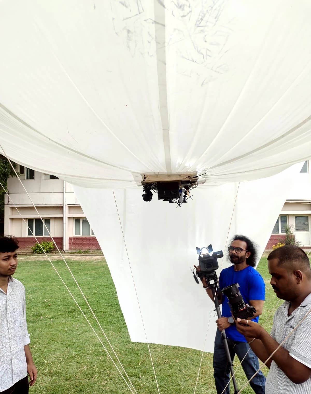 Camera crew filming the payload mount underneath the aerostat